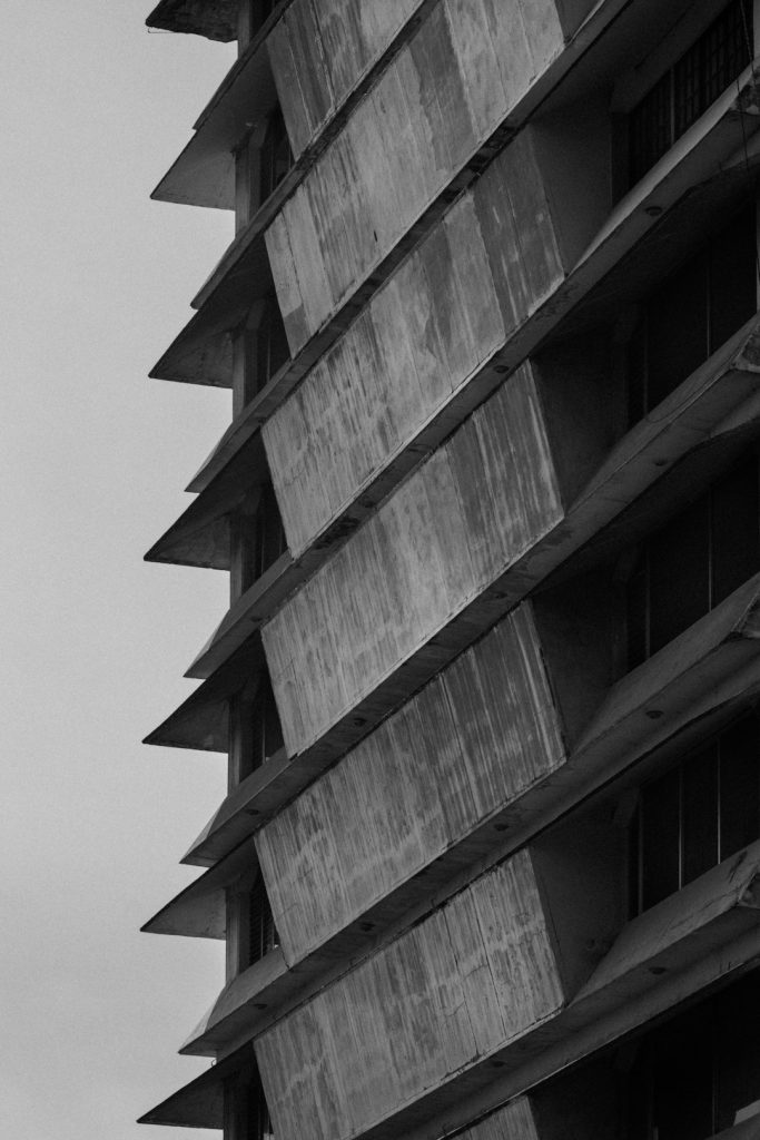 angular-concrete-building-facade-against-a-cloudy-sky-4ze-h-zgp2y